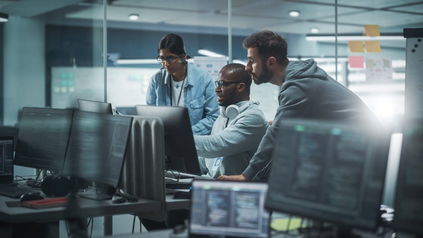 Security team collaborating on threat monitoring in a SOC environment